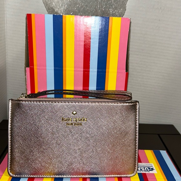 kate spade Handbags - Kate Spade Metallic Purple Wristlet
